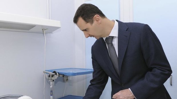Syria's President Bashar al-Assad, during his visit to troops wounded in clashes with rebels.