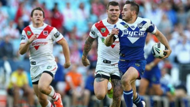 Dog off the leash: Josh Reynolds streaks away from Dragons defenders during Sunday's match.