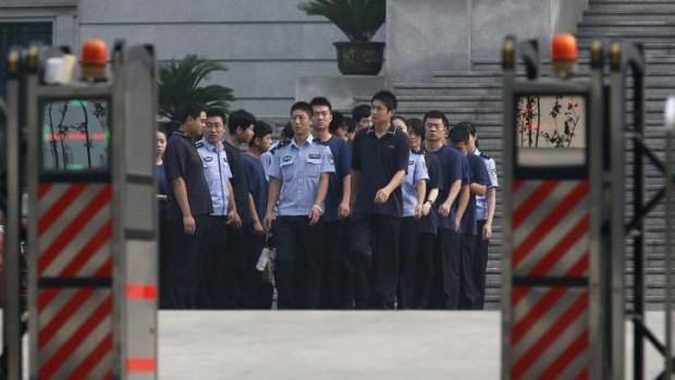 Policemen are seen at a court building where the trial for disgraced Chinese politician Bo Xilai is likely to be held in Jinan, Shandong province.