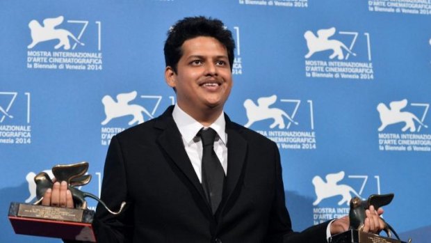 Writer-director Chaitanya Tamhane poses with the Orizzonti Award for Best Film and the Lion of the Future for his movie, <i>Court</i>, at the Venice Film Festival.