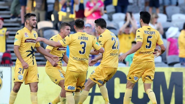 New year's resolve:  Mariners teammates celebrate their second goal during the round 13 A-League match between Central Coast and Wellington Phoenix at Central Coast Stadium on December 31.