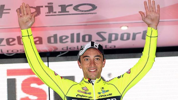Italy's Matteo Rabottini celebrates on the podium after winning the 15th stage of the Giro d'Italia.