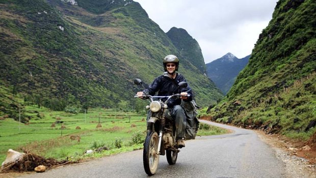 Roads to happiness ... one of the group's motorcyclists in the mountainous Ha Giang province.