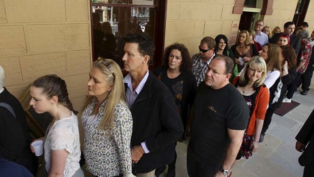 Members of the public line up to enter the gallery to hear NSW Premier Barry O'Farrell make a formal apology on behalf of the past state government on the issue of forced adoption.