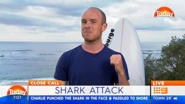 Charlie Fry punched a shark "in the nose" when it jumped at him on Monday.