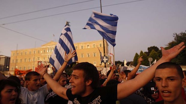 Protesters shout slogans during a rally against the austerity economic measures and corruption in Athens.