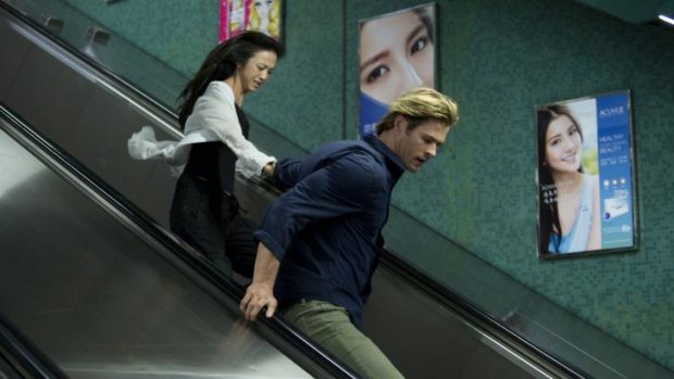 Irony: Wei Tang and Chris Hemsworth in Michael Mann's cyber-thriller <i>Blackhat</i> which opens in the US in mid-January.