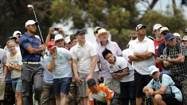 Tough day at the office . . . while Sergio Garcia wound back the clock with a stunning 65, former world No.1 Tiger Woods had to work hard for a second-round 72 at the halfway mark of the Australian Masters.