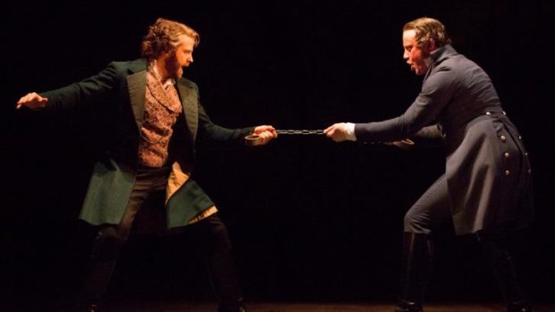 Jean Valjean (Simon Gleeson) and Javert (Hayden Tee) confront each other on stage.