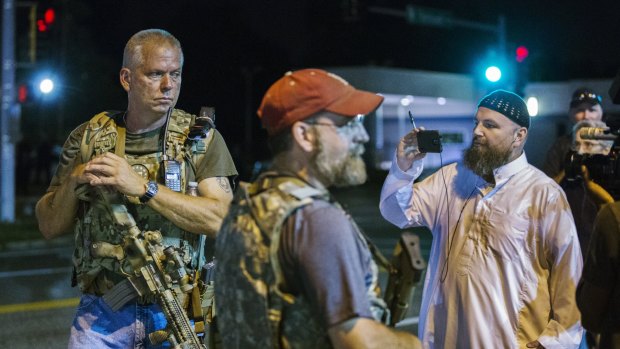 Heavily-armed members of the Oath Keepers keep watch on the streets during protests in Ferguson, Missouri.