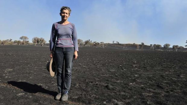 Property owner Catherine Frith stands on her property at Bogolara ... She lost more than 3000 livestock to the fires.