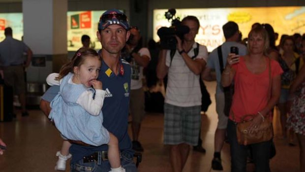 Barrage ... injured Australian Test captain Ricky Ponting arrives at Sydney airport yesterday with his daughter, Emmy.