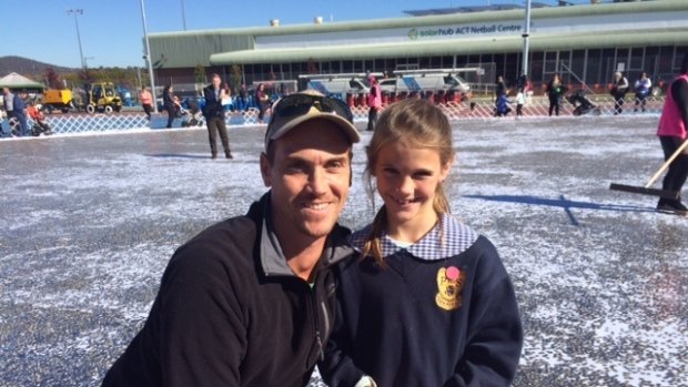 Matt Doble with his daughter Eve, seven. They travelled from Sydney to add the $973.35 in five cent pieces raised by the Oyster Bay Public School for the Big Heart Project.