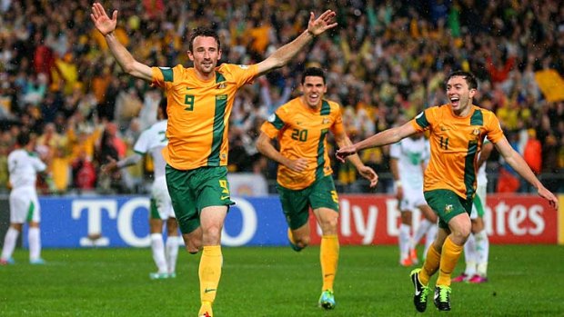 Josh Kennedy celebrates scoring the goal that booked Australia a place in the 2014 World Cup.