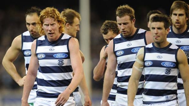 Skipper Cameron Ling, left, leads the Cats off the field after their finals loss to Collingwood in September. Geelong has made a swag of on- and off-field changes.