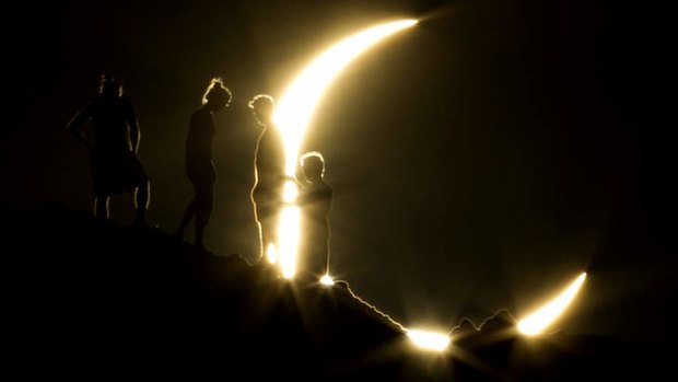 Hikers watch an annular eclipse from Papago Park in Arizona.