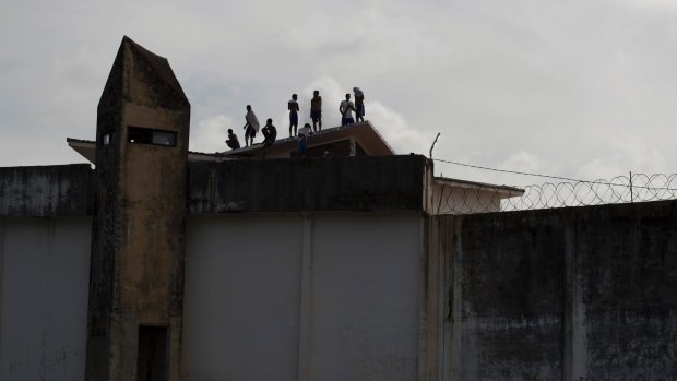 Inmates stand on the roof of Alcacuz prison amid tension between rival gangs in Nisia Floresta, near Natal, Brazil. 