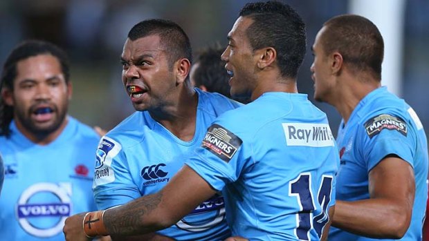 Blue-blooded performance: Kurtley Beale celebrates a try.