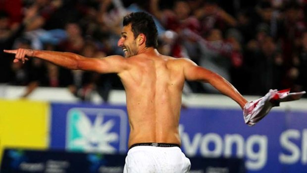 Grin and bare it: Labinot Haliti after scoring the only goal in a game against the Mariners. The Western Sydney player has become a central figure for the team.