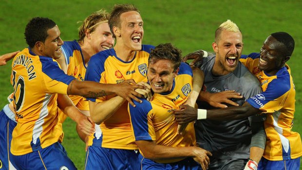 Happier times: Gold Coast United players celebrate a goal against Perth Glory.