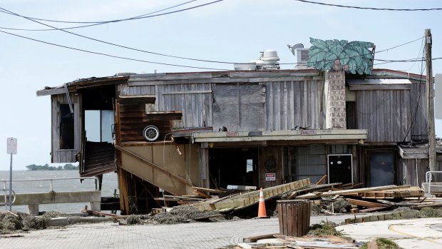 A damaged waterfront building in Cedar Key, Florida.