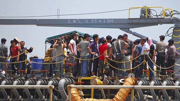 The asylum seekers are refusing to disembark.