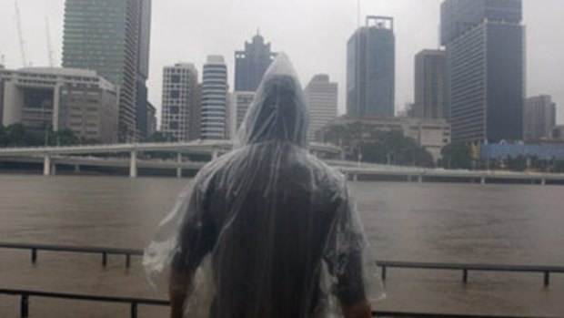 Preparing for the worst: the scene at the Brisbane River yesterday.