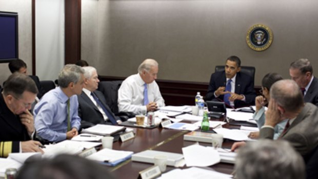 In this image released by the White House, President Barack Obama meets his national security team to discuss Afghanistan in the situation room of the White House.