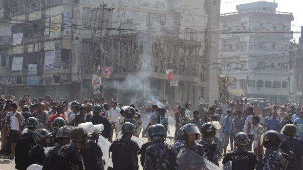 Police break up a protest by ethnic Madhesi protesters in Birgunj, on the border with India.
