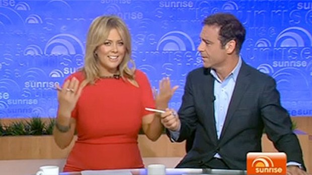 Caught in the crossfire ... Samantha Armatage and Andrew O'Keefe during the Qantas debate.