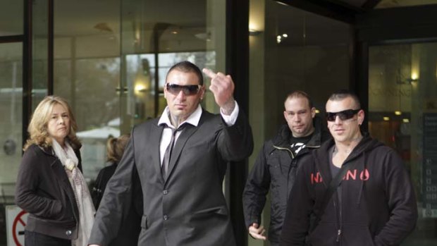 Intentions clear ... Nomads Sydney boss Jamie Zammit, second from left, leaves the Downing Centre Local Court yesterday.