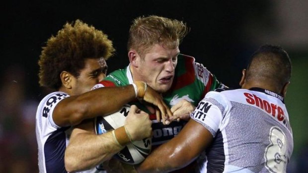 Powerhouse: Tom Burgess carries the ball into traffic.