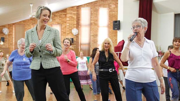 Boot-scooting Premier ... Kristina Keneally joins in line dancing at Toukley Senior Citizens Centre yesterday.