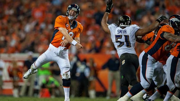Peyton Manning follows through on one of seven touchdown passes thrown against the Baltimore Ravens.