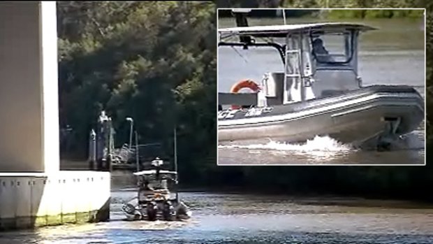 Water Police scour the Brisbane River for a missing Irish student. Photo: Ten News