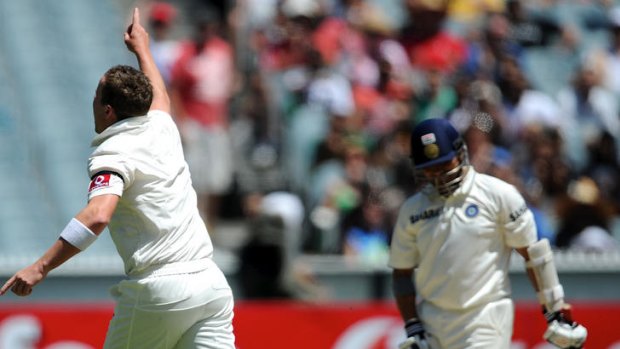 Celebration time ... Peter Siddle charges towards his teammates after dismissing Sachin Tendulkar.