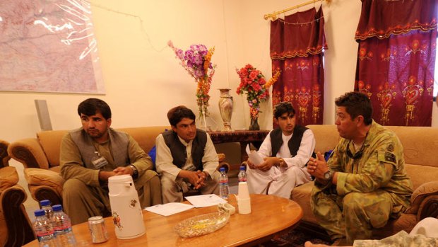 Ahmed Omed Khpulwak, left, meeting ADF public relations officers.