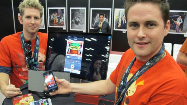 Joseph (L) and Sam Russell, brothers from Melbourne, show off their Jam smartphone app at SXSW in 2013.