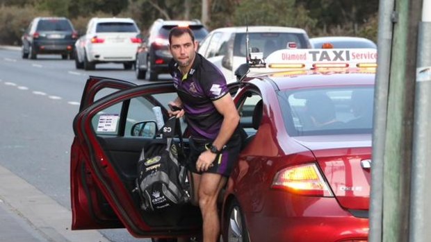 Breakdown: Storm skipper Cameron Smith arrives via taxi for the game against Cronulla.