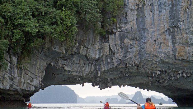 Under a sea arch in Halong Bay.
