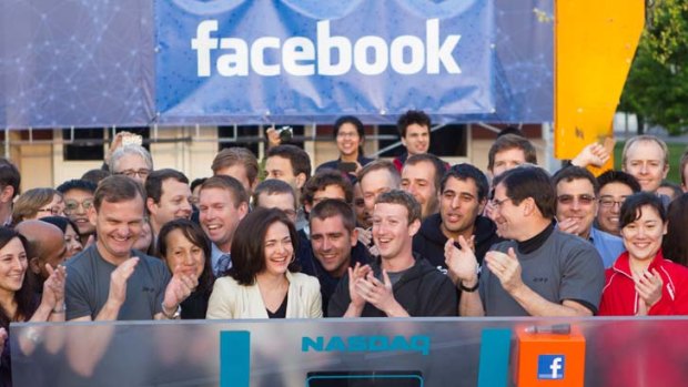 Smiles away &#8230; applause all around after Mark Zuckerberg rings the Nasdaq bell to mark the listing of Facebook.