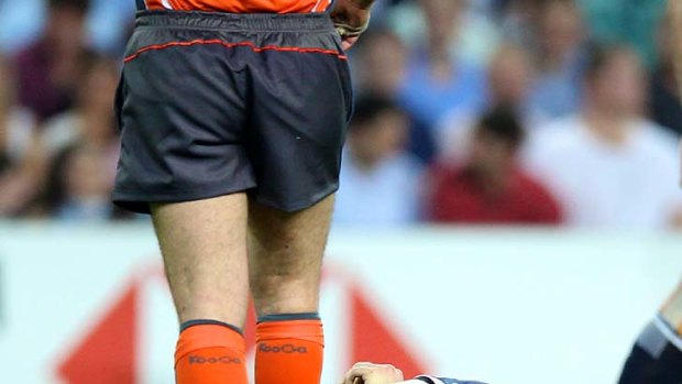 Hurt ... James O'Connor after colliding with Berrick Barnes.