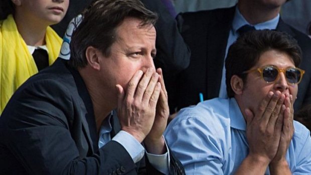 Horrified: British Prime Minister David Cameron reacts as he sees Cavendish crash