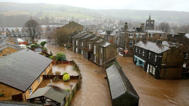 Floodwater rises as the River Calder bursts its banks, flooding the English town of Mytholmroyd.