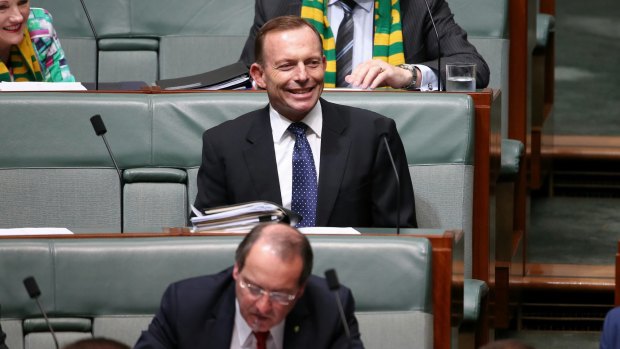 Former prime minister Tony Abbott sits behind Eden-Monaro MP Peter Hendy in Parliament in November.