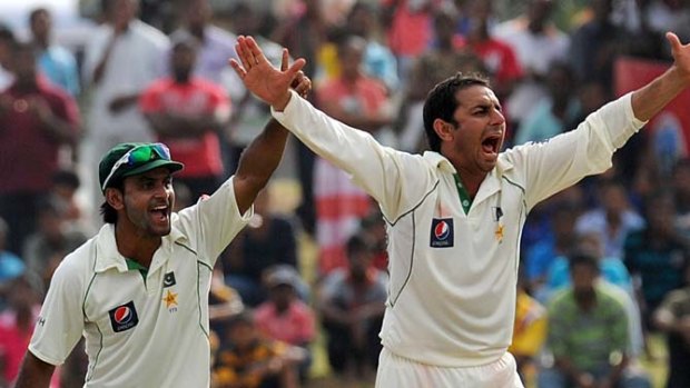 Pakistan captain Mohammad Hafeez and Saeed Ajmal appeal for an lbw decision during the first Test against Sri Lanka in Galle. The DRS was not used for the game in which at least 12 contentious decisions were given.