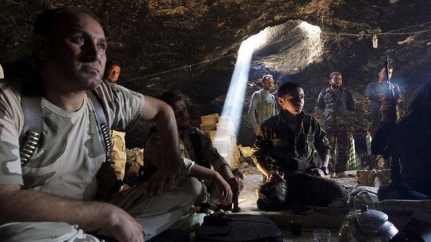 Free Syrian Army fighters gathered inside a cave in Maaret al-Naaman village, in Idlib.