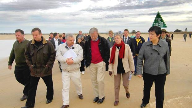 Prime Minister Kevin Rudd strolls along the edge of Lake Alexandrina in Milang.