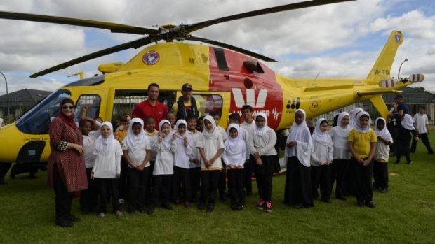 Ironman Ky Hurst hitched a ride with the Westpac Lifesaver Rescue Helicopter to visit the Australian Islamic School in Kewdale.
