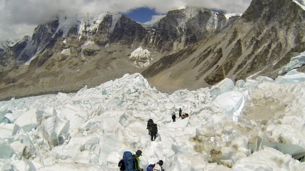 Climbers descend Khumbu Icefall on their way back to Base Camo after summitting Mount Everest. A new official route will be used in the next climbing season following last year's disaster
